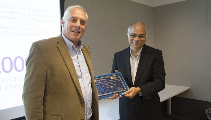Dr. Shivendra Panwar Electrical and Computer Engineering & Director, CATT presents Dr. Roberto Padovani with a plaque commemorating his presentation in the Jack Keil Wolf Lecture Series